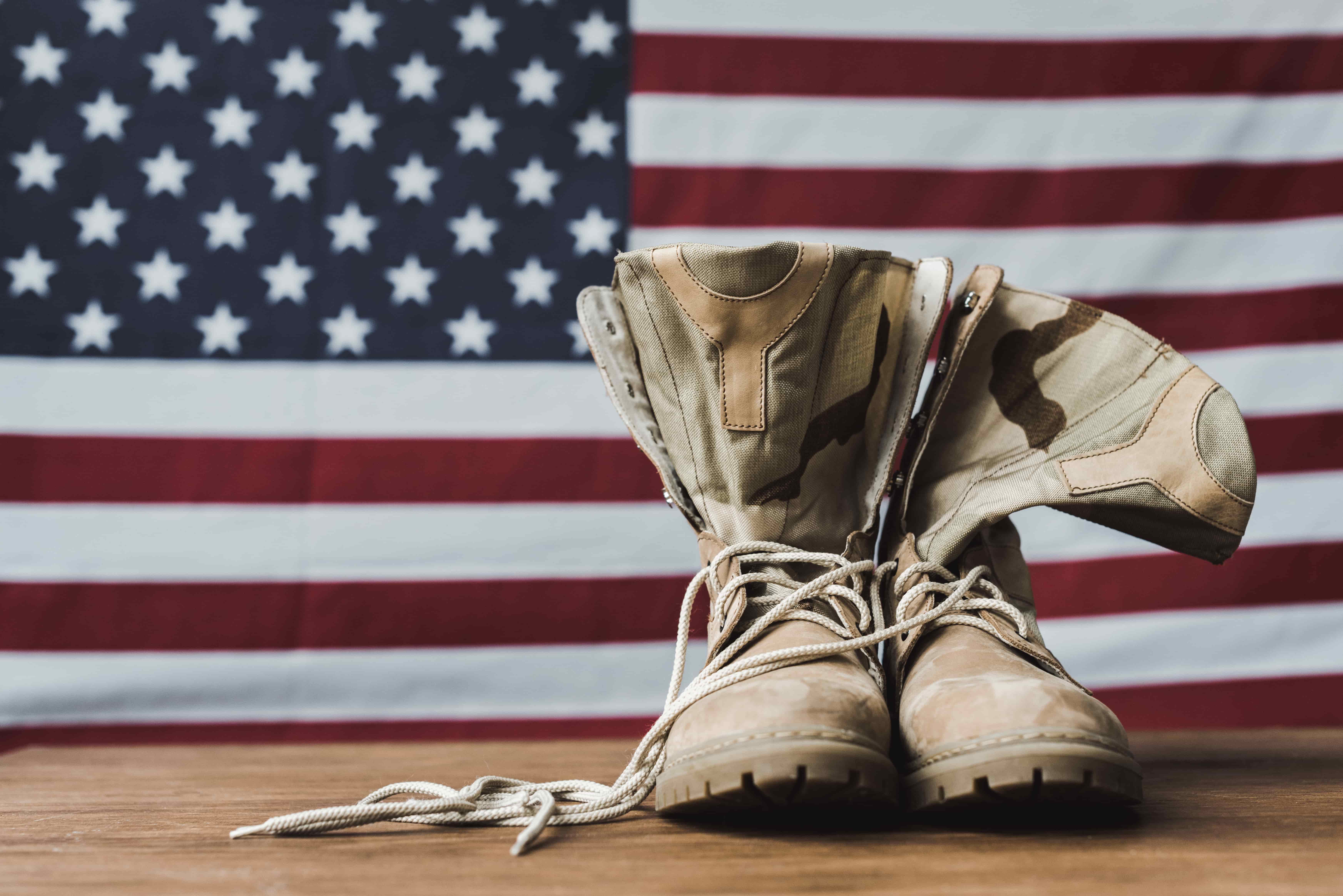 picture of military boots with american flag in background